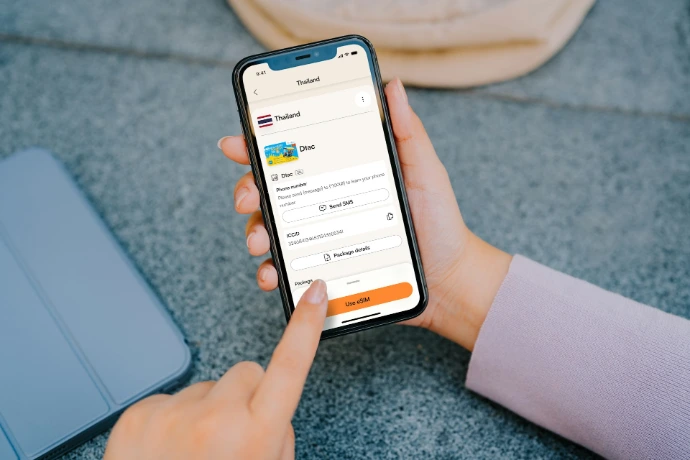 Person using a smartphone with learning app open